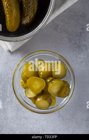 Homemade pickled fresh cucumbers, on a white background. Stock of food. Autumn concept. Top view, soft focus. Stock Photo