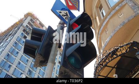 Bucharest, Romania - April 22, 2018: An office building is built in front of an old one at the intersection of Hristo Botev and Corneliu Coposu boulev Stock Photo