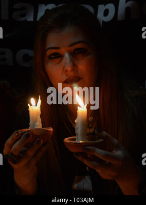 Lahore, Pakistan. 16th March 2019. Activists of civil society and members of civil society group 'Joint Action Committee for People Rights' hold placard and candle light vigil for the victims of Christchurch New Zealand mosque shooting, in Lahore on March 16, 2019. Pakistan's foreign minister says at least six Pakistanis were killed in the New Zealand mosque shootings. Credit: PACIFIC PRESS/Alamy Live News Stock Photo