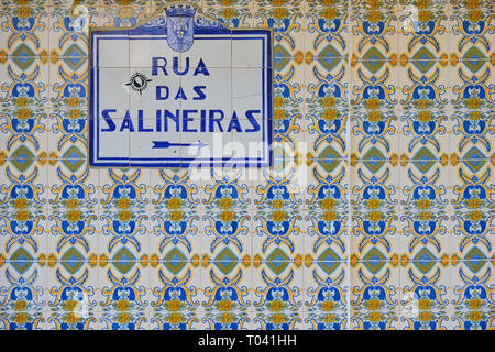 Azulejos (blue tiles) street signs "Rua das Salineiras" on wall on blue and yellow tiles.  Aveiro, Portugal Stock Photo