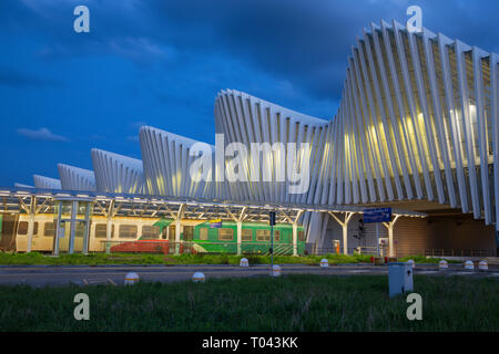 REGGIO EMILIA, ITALY - APRIL 13, 2018:  The Reggio Emilia AV Mediopadana railway station at dusk by architect Santiago Calatrava. Stock Photo