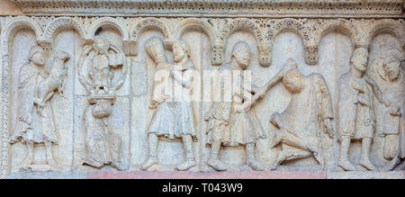 MODENA, ITALY - APRIL 14, 2018: The romanesque relief of Kain and Abel from paradise on the facade of Duomo di Modena. Stock Photo