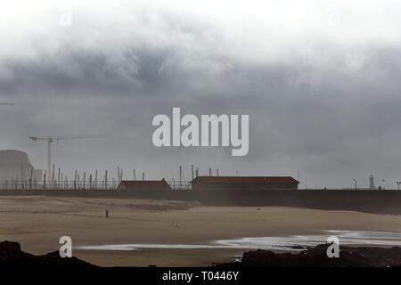 An empty beach from the north of Portugal in Autumn. North wall of Leixoes harbor. Stock Photo