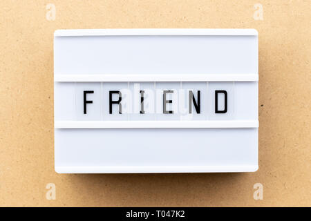 Light box with word friend on wood background Stock Photo