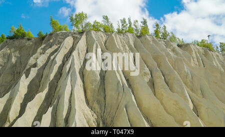 A white mountain of white stones in Rummu Vasalema Estonia. The erosion from the quarry in the limestone quarry Stock Photo