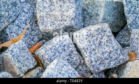 Lots of marble stones in cube sizes on the floor these marble stones are used in house masonry construction Stock Photo