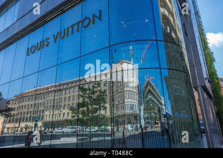Warsaw, Poland - July 24, 2017 : Reflections on the facade of Louis Vuitton store. located in Aleje Jerozolimskie street at shopping mall Vitkac. Luxu Stock Photo
