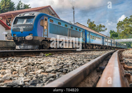 One of the most famous train journeys in the world, the train from Kandy to Ella pulls into the station at Ella in Badulla District of Uva Province, S Stock Photo