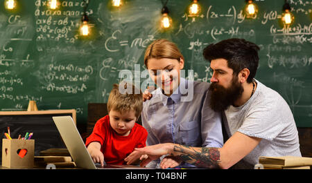 Lecturer discussing architectural issues with students during workshop, Mature tutor teacher giving private lessons to preschool boy, Concept Stock Photo