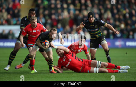 Northampton Saints Rory Hutchinson is tackled by Saracens Nick Isiekwe during the Premiership Rugby Cup Final at Franklin's Gardens, Northampton. Stock Photo