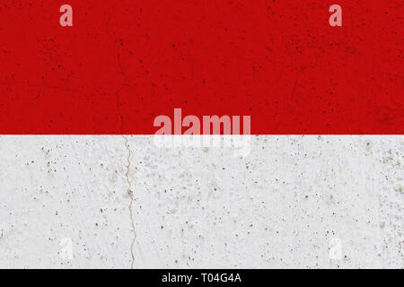 Indonesia flag on concrete wall. Patriotic grunge background. National flag of Indonesia Stock Photo