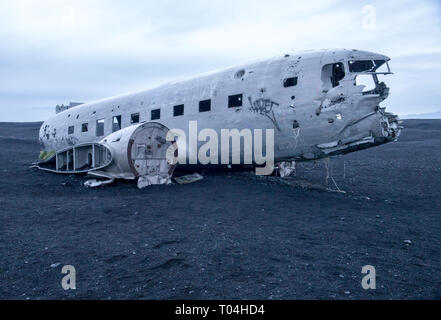 Wreckage of crashed airplane Dakota United States Navy Douglas Super DC-3 on the coast of iceland black sand beach. Solheimasandur, Iceland Stock Photo