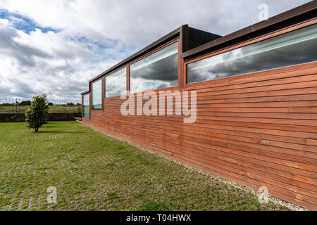 modern building with wood cladding. Cloudy sky Stock Photo