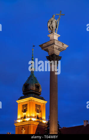 King Sigismund III Vasa column and clocktower of the Royal Castle at night, city of Warsaw, Poland. Stock Photo