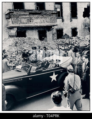 President Truman 1945 Berlin Ruins Post WW2 1945 photograph ( L to R ) in rear seat of car: President Harry S. Truman, Secretary of State James Byrnes, and Fleet Admiral William Leahy inspect the ruins of Hitler's Chancellery in Berlin, Germany. President Truman is in Germany to attend the Potsdam Conference. Stock Photo