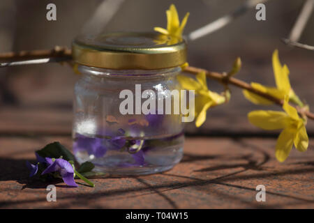 Spring, still life, violet, laburnum,  cake, pear tatin Budapest March 17, 2019 Stock Photo