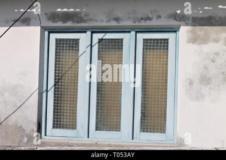 Three windows in a broken wall (Ari Atoll, Maldives) Stock Photo