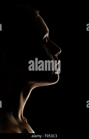 sad woman profile silhouette on black background looking down Stock Photo -  Alamy