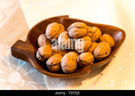 Nuts lie in a bowl on grandmother's table Stock Photo