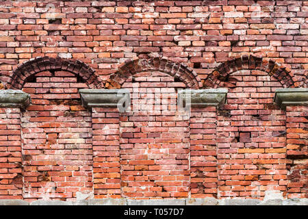 Recess arch frame in old brick wall Stock Photo