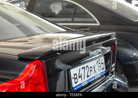 Novosibirsk, Russia - 08.01.18: Rear spoiler on the trunk of black used Volvo S60 car stands in the auto sale after wadhing Stock Photo