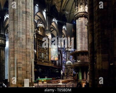 MILAN, ITALY - FEBRUARY 24, 2019: visitors near presbytery in Milan Cathedral (Duomo di Milano, Basilica Cattedrale Metropolitana di Santa Maria Nasce Stock Photo