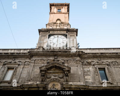 MILAN, ITALY - FEBRUARY 24, 2019: facade of palace Palazzo Giureconsulti (Palazzo Affari) congress center of Chamber of Commerce on square Piazza Merc Stock Photo