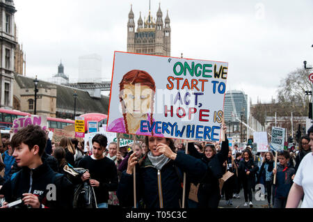 London. School students strike for climate change , part of a global action. A protester holds a painting of nobel-nominated Greta Thunberg with a quo Stock Photo