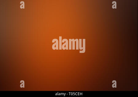 brown blurred background. dark orange background gradient. Stock Photo
