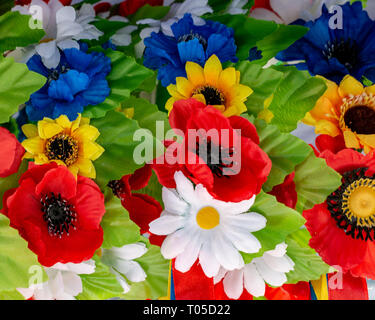 arrangement bouquet poppies, daisies, sunflowers green leaves Stock Photo