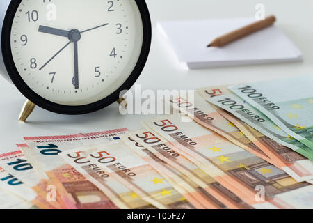 European currency, Euro money with alarm clock, card and pencil Stock Photo