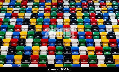 Many rows of bright colorful plastic seats, grandstand stadium, for background Stock Photo