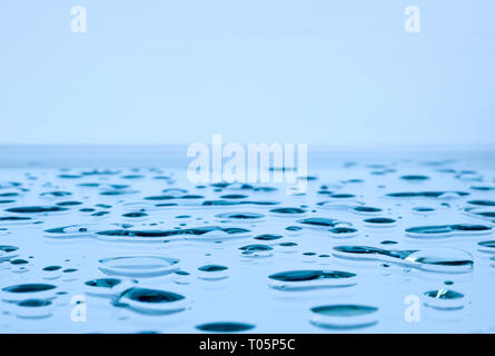 Large drops of water on horizontal glass Stock Photo