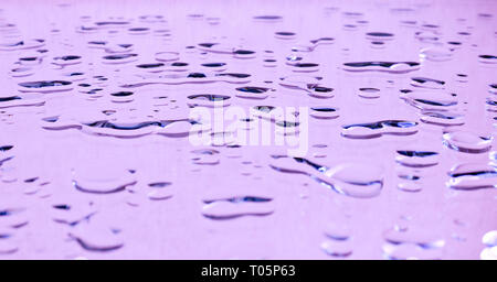 Large drops of water on horizontal glass Stock Photo