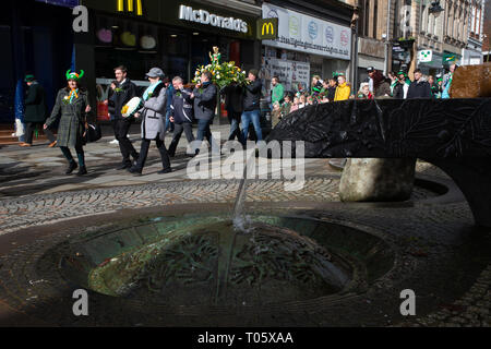 Cheshire, UK. 17th March 2019.  The annual St Patrick’s Day Parade took place, starting at 10.30 in the morning from The Irish Club in Orford Lane to ‘The River of Life’ in Bridge Street in the Town Centre, where a short service was held to remember the 25th anniversary of the Warrington Bombing Credit: John Hopkins/Alamy Live News Stock Photo