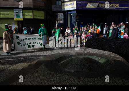 Cheshire, UK. 17th March 2019.  The annual St Patrick’s Day Parade took place, starting at 10.30 in the morning from The Irish Club in Orford Lane to ‘The River of Life’ in Bridge Street in the Town Centre, where a short service was held to remember the 25th anniversary of the Warrington Bombing Credit: John Hopkins/Alamy Live News Stock Photo