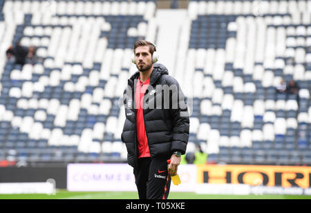 17 March 2019, Hessen, Frankfurt/Main: Soccer: Bundesliga, Eintracht Frankfurt - 1st FC Nuremberg, 26th matchday in the Commerzbank Arena. Frankfurt's goalkeeper Kevin Trapp stands in front of the opposing tribune with the Frankfurt city coat of arms. Photo: Arne Dedert/dpa - IMPORTANT NOTE: In accordance with the requirements of the DFL Deutsche Fußball Liga or the DFB Deutscher Fußball-Bund, it is prohibited to use or have used photographs taken in the stadium and/or the match in the form of sequence images and/or video-like photo sequences. Credit: dpa picture alliance/Alamy Live News Credi Stock Photo