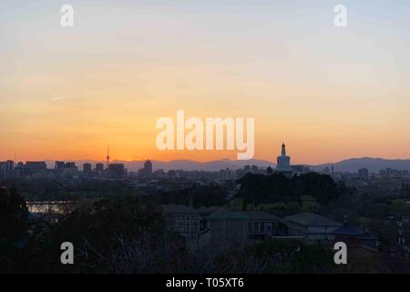 Beijing, China. 16th Mar, 2019. Photo taken with a mobile phone at Jingshan Park shows the sunset in Beijing, capital of China, March 16, 2019. Credit: Zhang Haofu/Xinhua/Alamy Live News Stock Photo