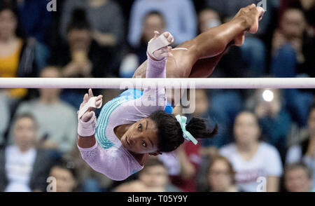 Stuttgart, Germany. 17th Mar, 2019. Gymnastics, World Cup: all-around, women in the Porsche Arena: Simone Biles from the USA gymnastics on uneven bars. Credit: Marijan Murat/dpa/Alamy Live News Stock Photo