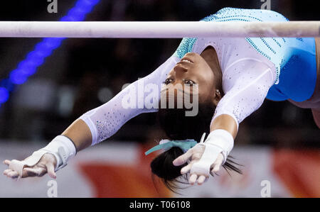 Stuttgart, Germany. 17th Mar, 2019. Gymnastics, World Cup: all-around, women in the Porsche Arena. Simone Biles from the USA does gymnastics on uneven bars. Credit: Marijan Murat/dpa/Alamy Live News Stock Photo