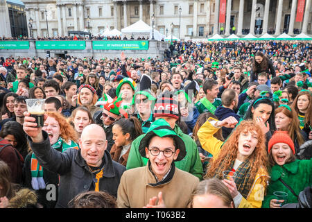 London, UK. 17th Mar, 2019.  Revellers in the Square. Following the spectacular St Patrick's Day Parade earlier, people celebrate and watch performances on Trafalgar Square in the heart of London. Credit: Imageplotter/Alamy Live News Stock Photo