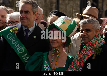 London, UK. 17th March, 2019. The mayor of London, Sadiq Khan, receives a warm scarf in the Irish colours orange, white and green and opens the St Patrick's Day Parade London near Piccadilly, UK, today. Credit: Joe Kuis / Alamy Live News Stock Photo