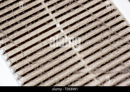 Cleaning ventilation plastic frame dust. the filter is completely clogged with dust and dirt. Dirty ventilation system in the room. Disinfection servi Stock Photo