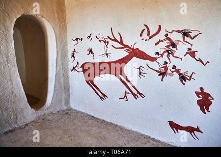 Recontructed fresco of an original found at Catalhoyuk. The men are hunting a deer and pulling on its tounge to disable it. The hunters are believed b Stock Photo