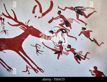 Recontructed fresco of an original found at Catalhoyuk. The men are hunting a deer and pulling on its tounge to disable it. The hunters are believed b Stock Photo