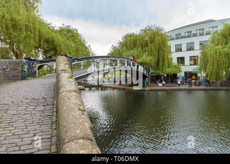 Camden Town, London, UK - April 30, 2018: People cross the bridge over the Regent's canal in Camden Town in London Stock Photo