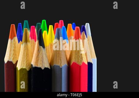 Closeup of colorful crayon pencils on black background with copy space.  Back to school concept. Drawing concept. Free space for text Stock Photo