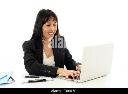 Young beautiful businesswoman working on laptop at office desk feeling happy and success. Isolated on neutral background. In people business education Stock Photo