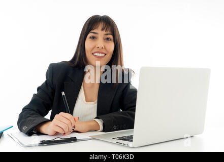 Young beautiful businesswoman working on laptop at office desk feeling happy and success. Isolated on neutral background. In people business education Stock Photo