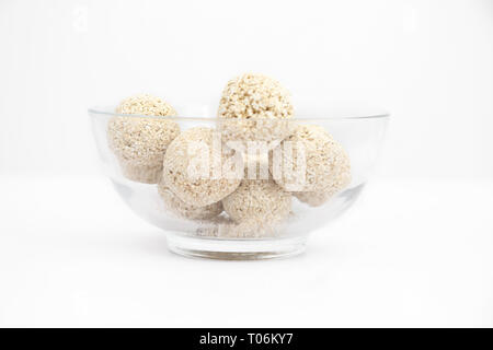 Cholai ke ladoo in the glass bowl. Isolated on the white background. Stock Photo